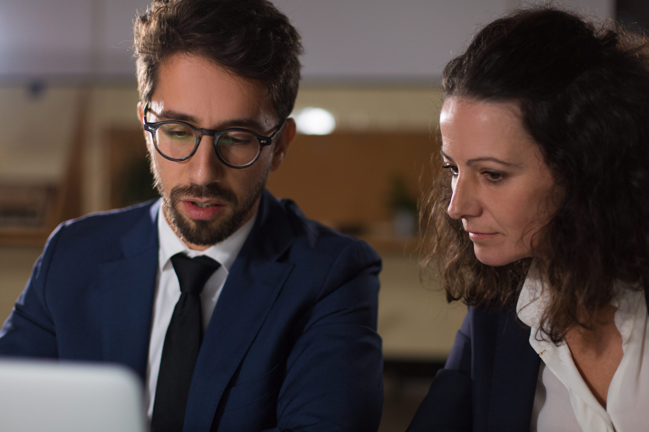 Focused business people working with laptop